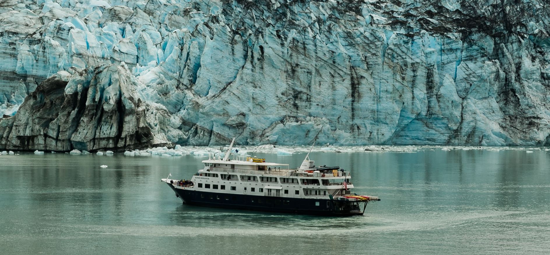 Glacier and ship in Alaska waters